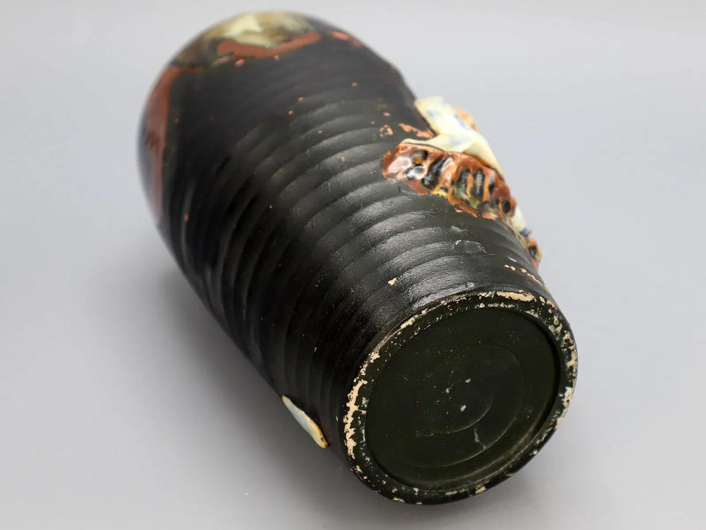 Antique Early 20th Century Japanese Sumida Gawa Drip Pottery Vase. A Tall Dark Brown Vase With Two Applied Figurines Of Old Men, Taisho Era