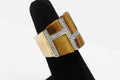 PalmBeach Jewelry 0.46 TCW Emerald Cut Genuine Tiger's Eye Cubic Zirconia Accent Yellow Gold-Plated Band Ring Size 4 1/2