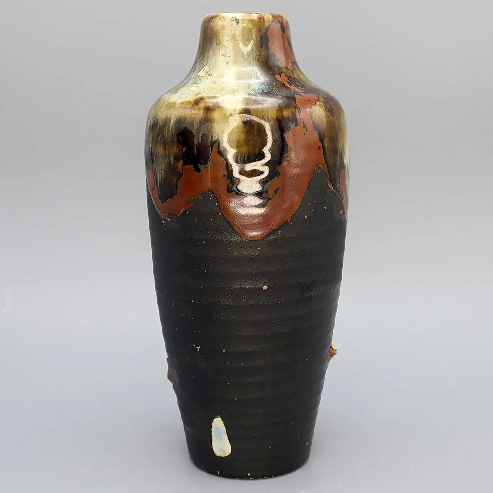 Antique Early 20th Century Japanese Sumida Gawa Drip Pottery Vase. A Tall Dark Brown Vase With Two Applied Figurines Of Old Men, Taisho Era