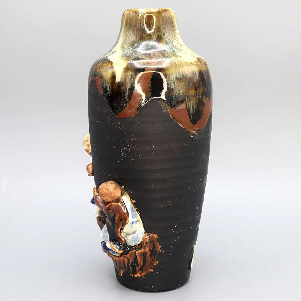 Antique Early 20th Century Japanese Sumida Gawa Drip Pottery Vase. A Tall Dark Brown Vase With Two Applied Figurines Of Old Men, Taisho Era