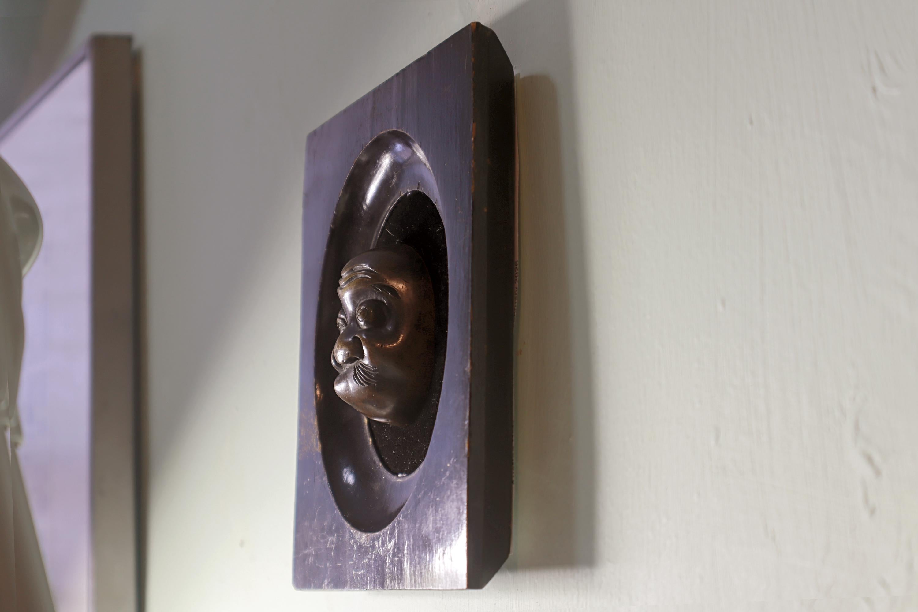 Antique Early 20th Century Taisho Era Japan Decorative Wall Hanging Mask. Hyottoko Bronze Miniature Figure On Art Deco Wooden Frame