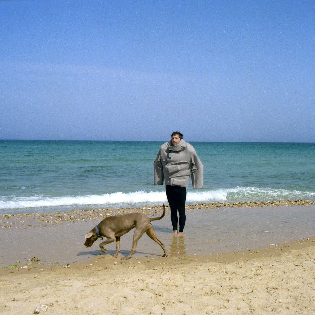 An Idol Of Our Times, Tel Aviv Jaffa Israel, Color Analogue Photography, Sunny Summer Seashore, Jewish Male Model Brutalist Fashion Clothing